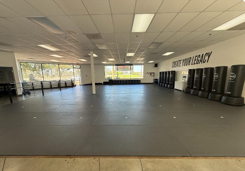 Main training mat with the Create Your Legacy mural