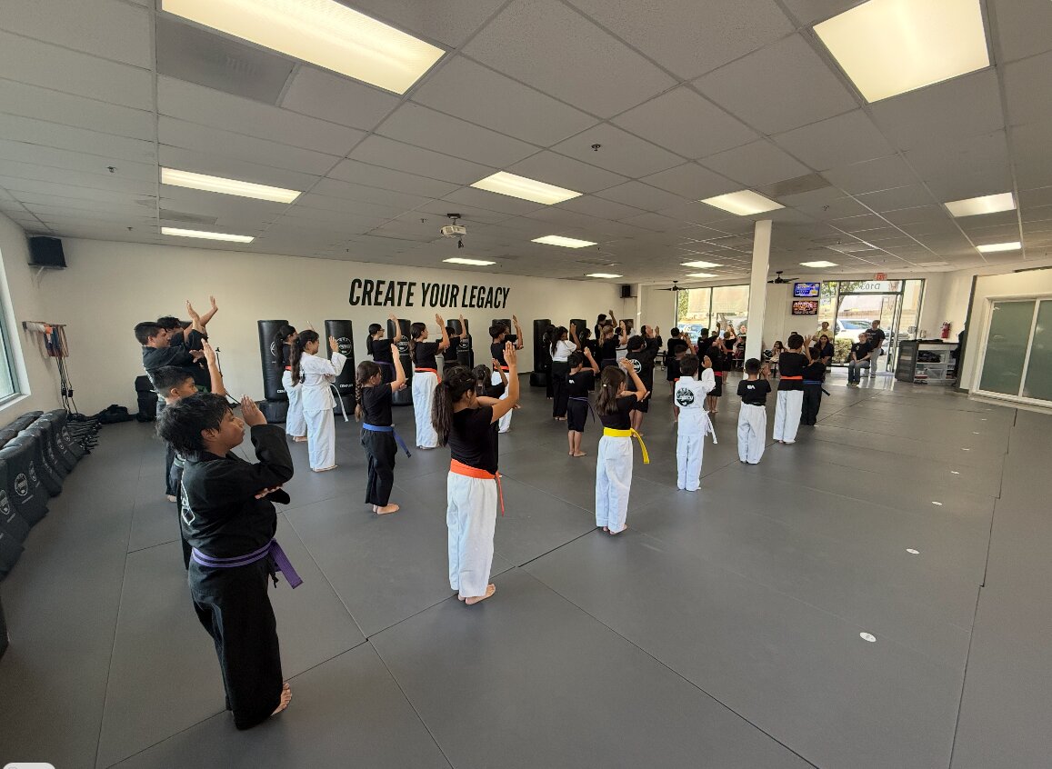 A full youth class training on the main mat at Legacy Martial Arts
