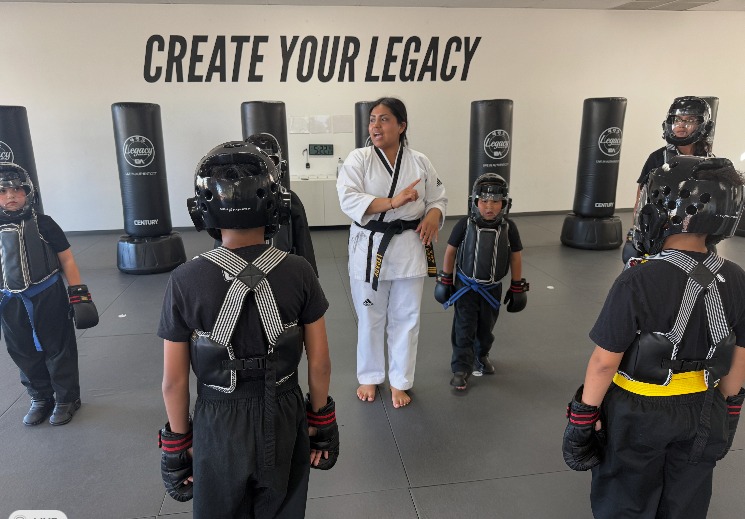 Ms. Rocio Rosales coaching a circle of geared-up young students