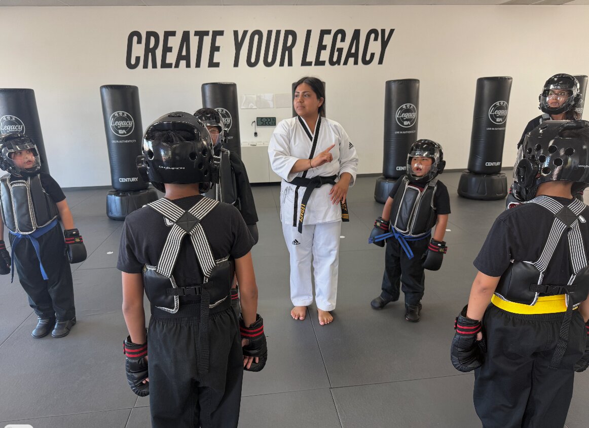 Instructor with young students at Legacy Martial Arts