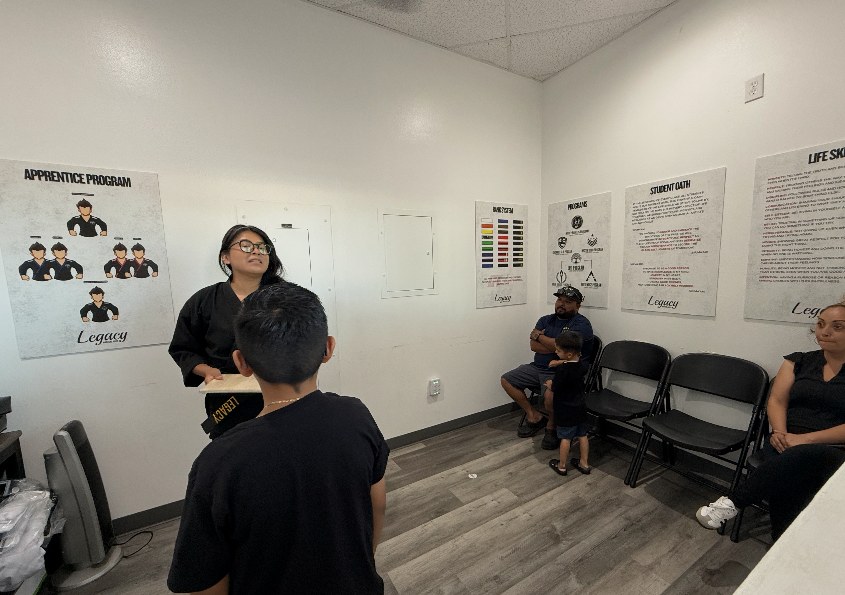 Apprentice instructor leading a small group in the lobby training area